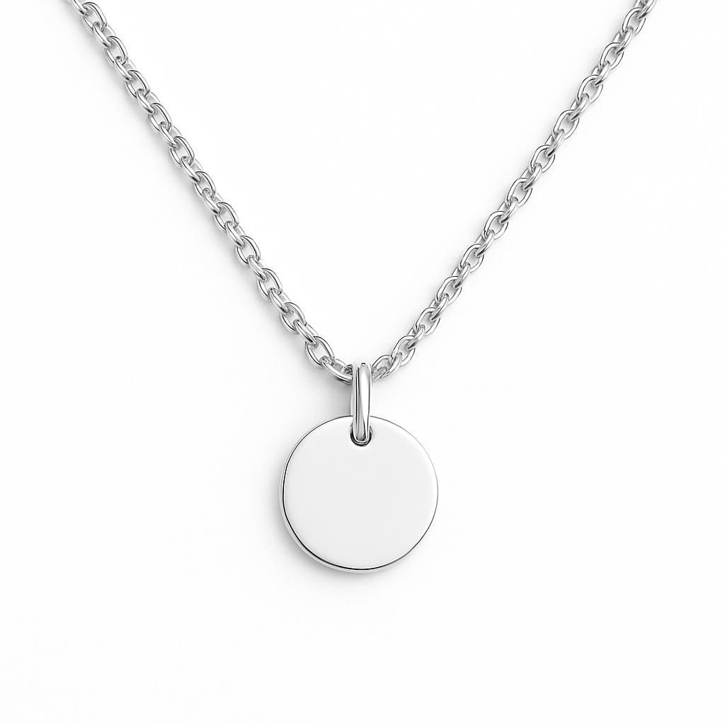 Silver necklace with a round pendant on a white background