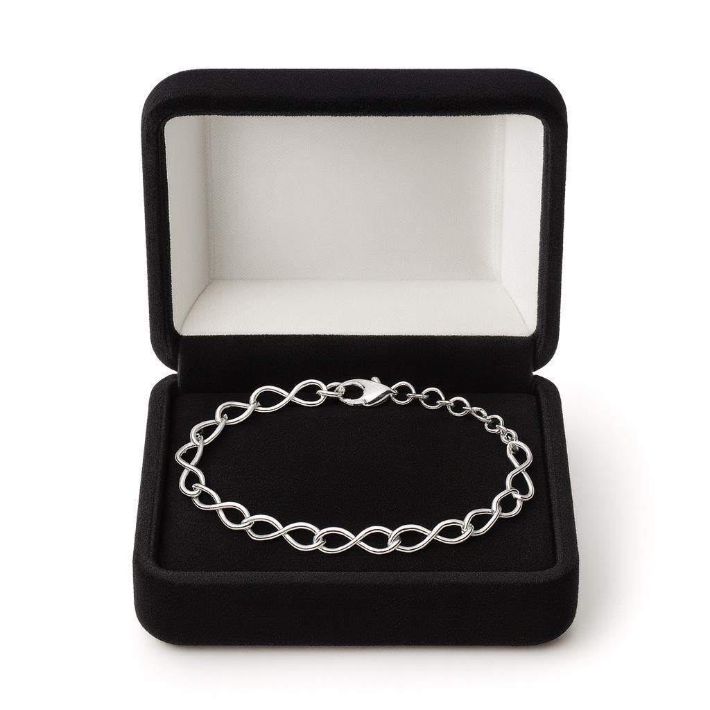 Silver bracelet in a black jewelry box on a white background