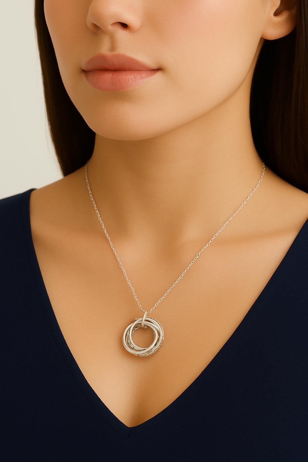 interlocking rings necklace, sterling silver pendant necklace, silver circle necklace, unity necklace, minimalist silver necklace, triple ring pendant, hammered silver necklace, beaded silver pendant, modern geometric necklace, handcrafted silver jewelry, dainty silver necklace, layering silver necklace, sterling silver chain necklace, artisan made jewelry, everyday silver jewelry, simple elegant necklace, gift for her jewelry, bridesmaid silver necklace, anniversary necklace, St Clair Fine Jewelry necklace