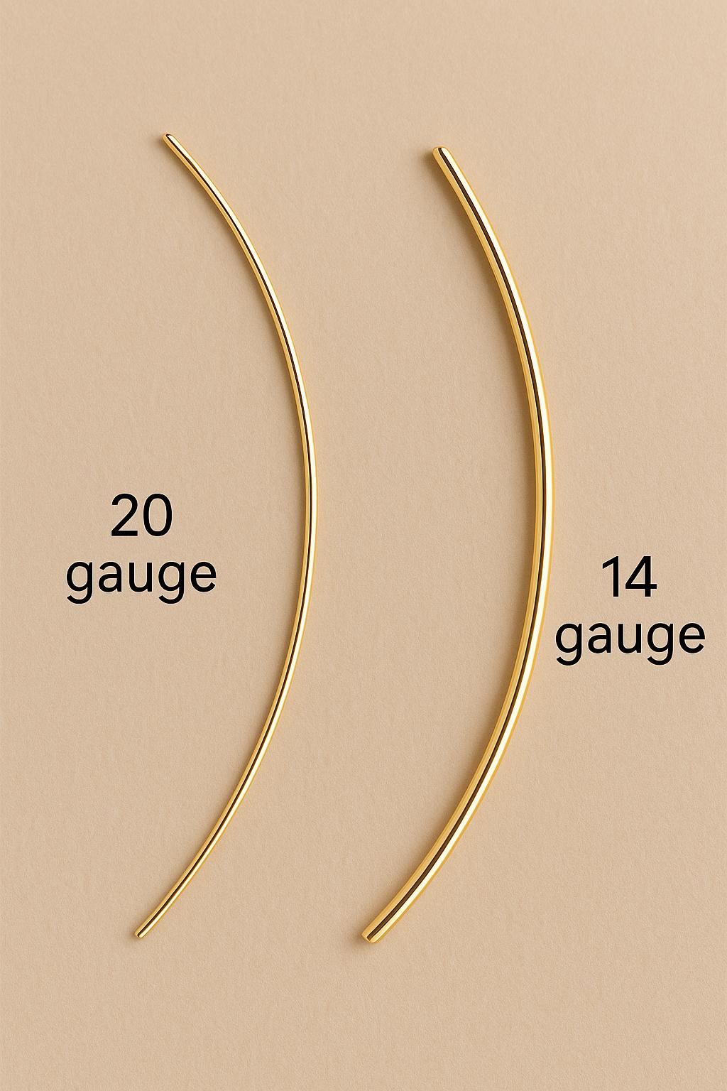 Two gold metal rods labeled '20 gauge' and '14 gauge' on a beige background