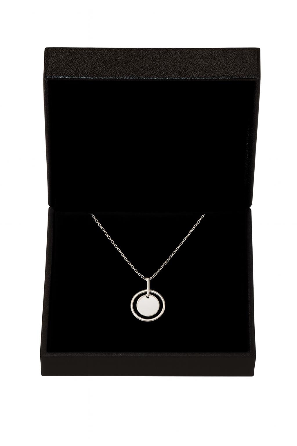 Silver necklace with a pendant in a black jewelry box on a white background