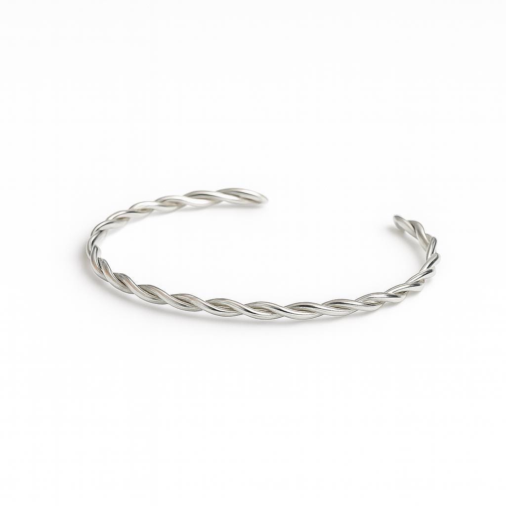 Silver braided bracelet on a white background