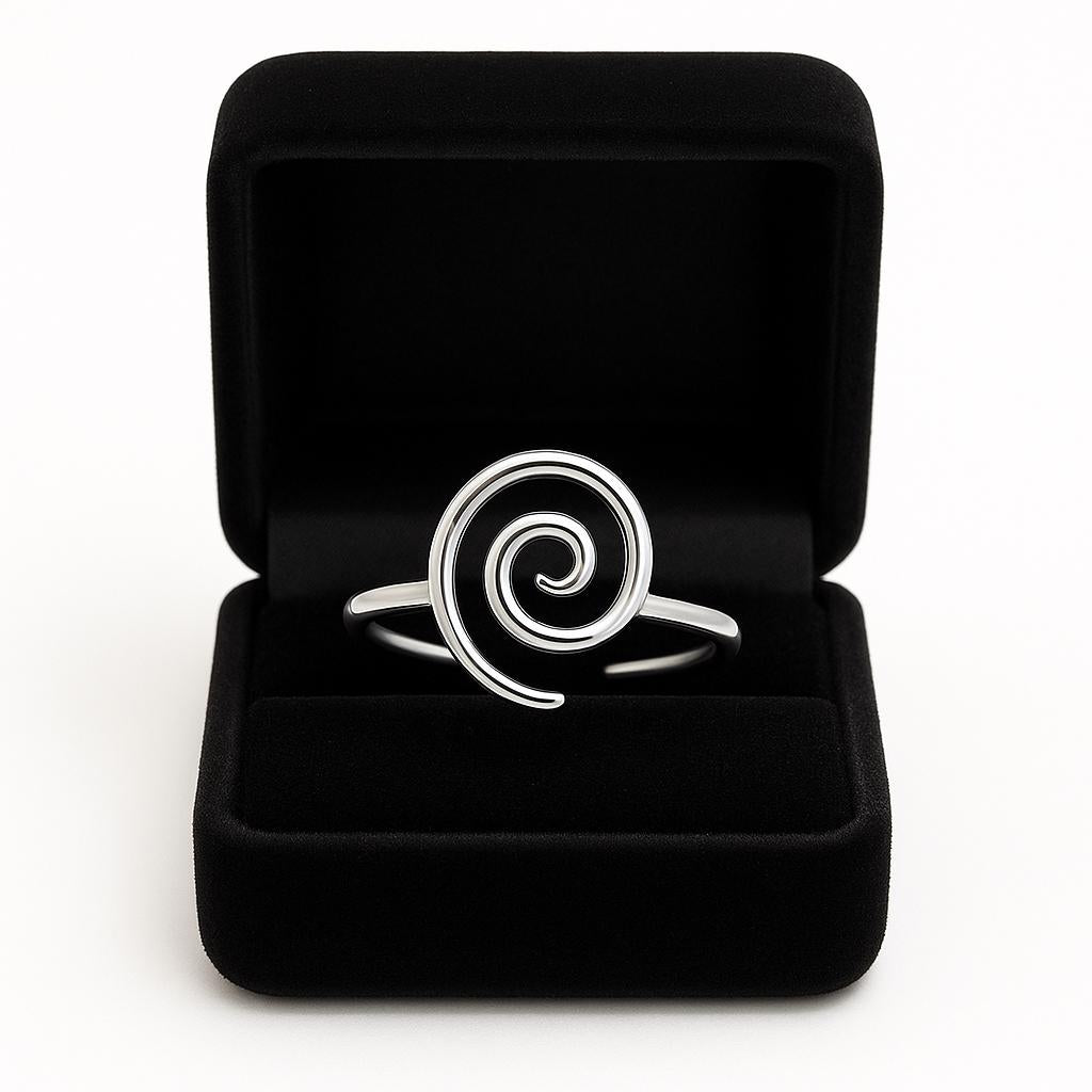 Silver spiral ring in a black jewelry box on a white background