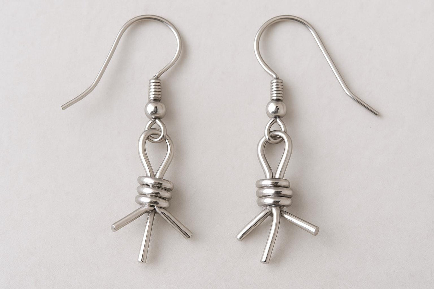 barbed wire earrings, western hoop earrings, gold filled hoop earrings, sterling silver hoop earrings, cowboy jewelry, cowgirl earrings, boho western earrings, handcrafted gold hoops, silver barbed wire earrings, rodeo jewelry, desert inspired jewelry, 14k gold filled jewelry, modern western jewelry, rustic chic earrings, handmade in USA jewelry, hammered gold hoops, lightweight hoop earrings, festival jewelry, edgy modern earrings, St Clair Fine Jewelry earrings, artisan made jewelry, gold and silver earri