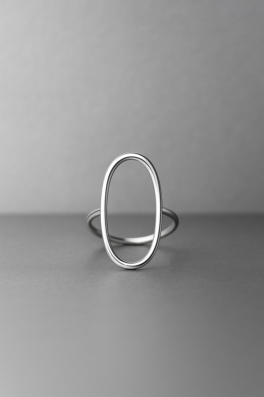 Silver ring on a gray background