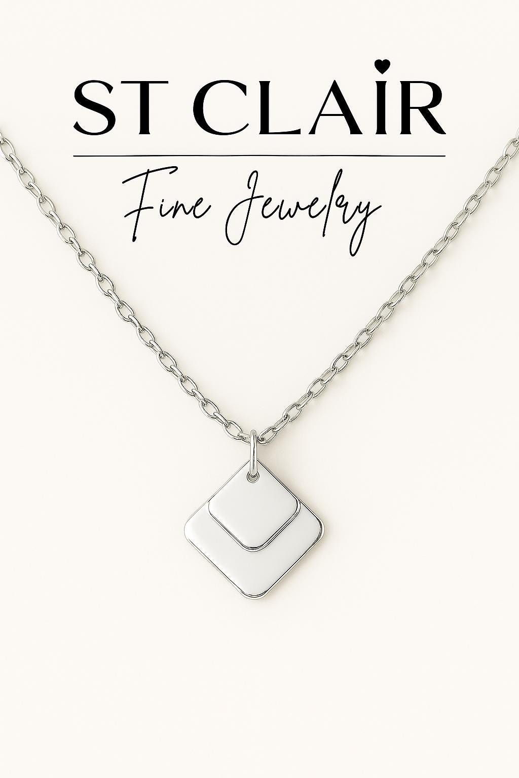 Necklace with a white pendant on a white background, featuring 'ST CLAIRE' branding.