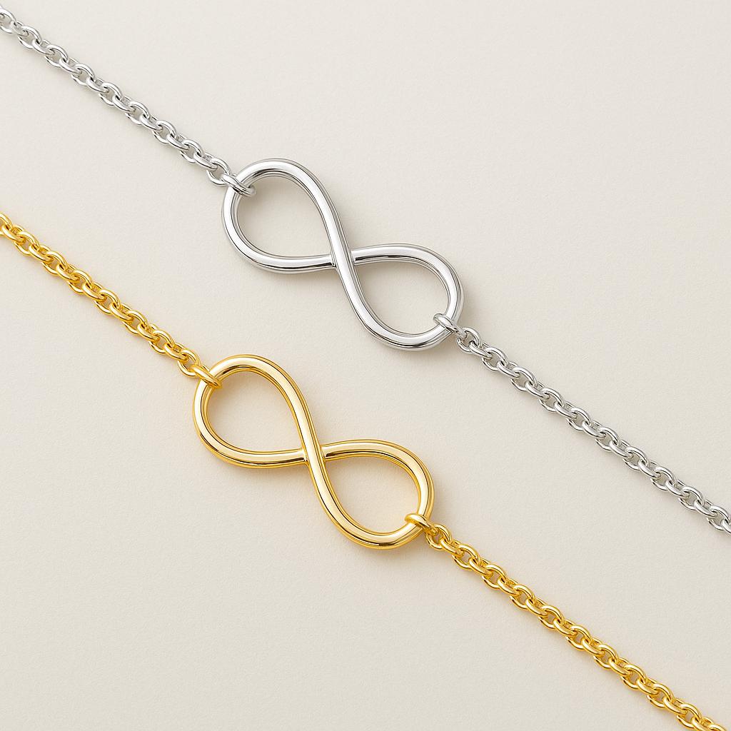 Two infinity symbol anklets, one gold and one silver, on a light beige background.