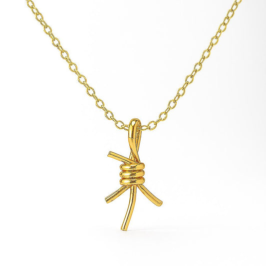 Gold necklace with a unique pendant on a white background
