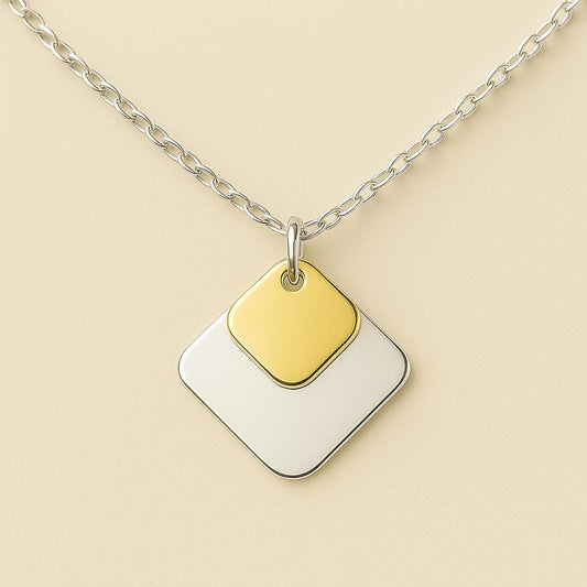 Necklace with a gold and white square pendant on a beige background