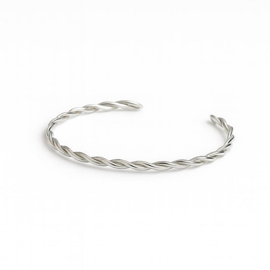 Silver braided bracelet on a white background
