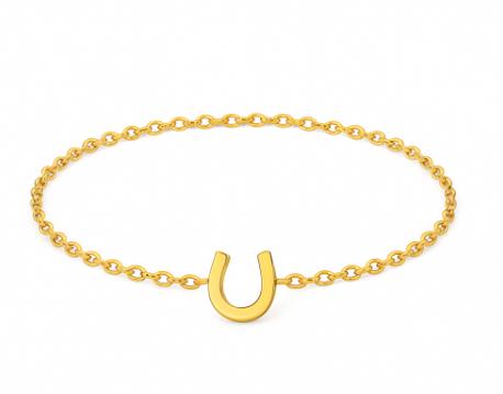 Gold bracelet with a horseshoe charm on a white background
