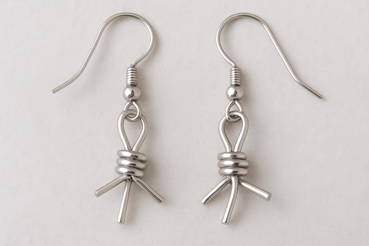 barbed wire earrings, western hoop earrings, gold filled hoop earrings, sterling silver hoop earrings, cowboy jewelry, cowgirl earrings, boho western earrings, handcrafted gold hoops, silver barbed wire earrings, rodeo jewelry, desert inspired jewelry, 14k gold filled jewelry, modern western jewelry, rustic chic earrings, handmade in USA jewelry, hammered gold hoops, lightweight hoop earrings, festival jewelry, edgy modern earrings, St Clair Fine Jewelry earrings, artisan made jewelry, gold and silver earri