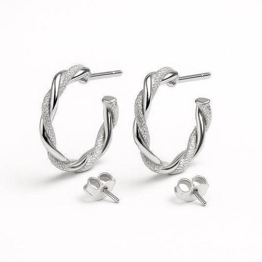 Silver hoop earrings on a white background