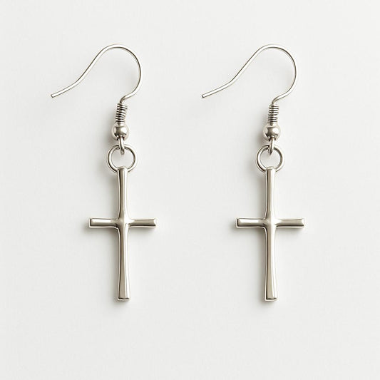 Silver cross-shaped earrings on a white background