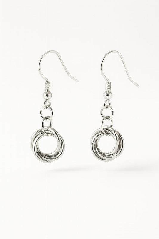 sterling silver love knot earrings, silver knot earrings, love knot dangle earrings, minimalist silver earrings, dainty sterling silver earrings, handmade silver earrings, silver drop earrings, knot earrings for women, classic silver earrings, everyday silver earrings, silver jewelry gift for her, bridesmaid earrings silver, modern romantic jewelry, handcrafted sterling silver jewelry, lightweight dangle earrings, hypoallergenic silver earrings, symbolic knot jewelry, silver anniversary gift, artisan silver